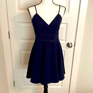 Jun & Ivy| Navy spaghetti strap sundress with embellishments at the waist.